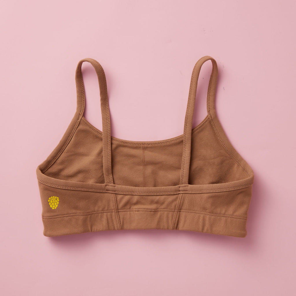Styled detail image of Yellowberry Sky Bra in mocha. The Sky Hybrid Sports Bra is double-layered and fully lined to ensure full coverage and medium to high support. Softest fabrics, AND made by a female founded company.
