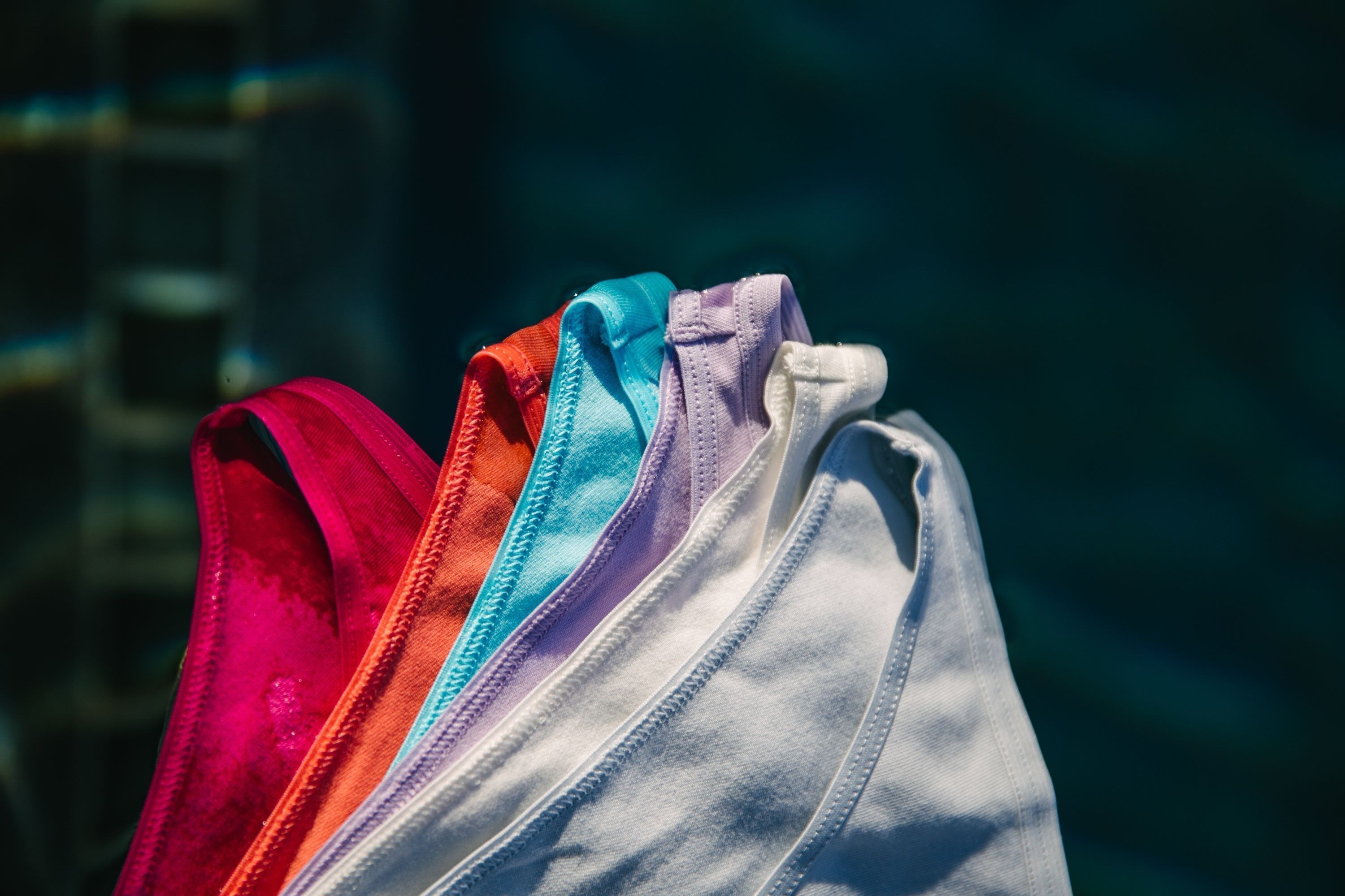 An assortment of Yellowberry Underwear arranged in order of the colors of the rainbow.