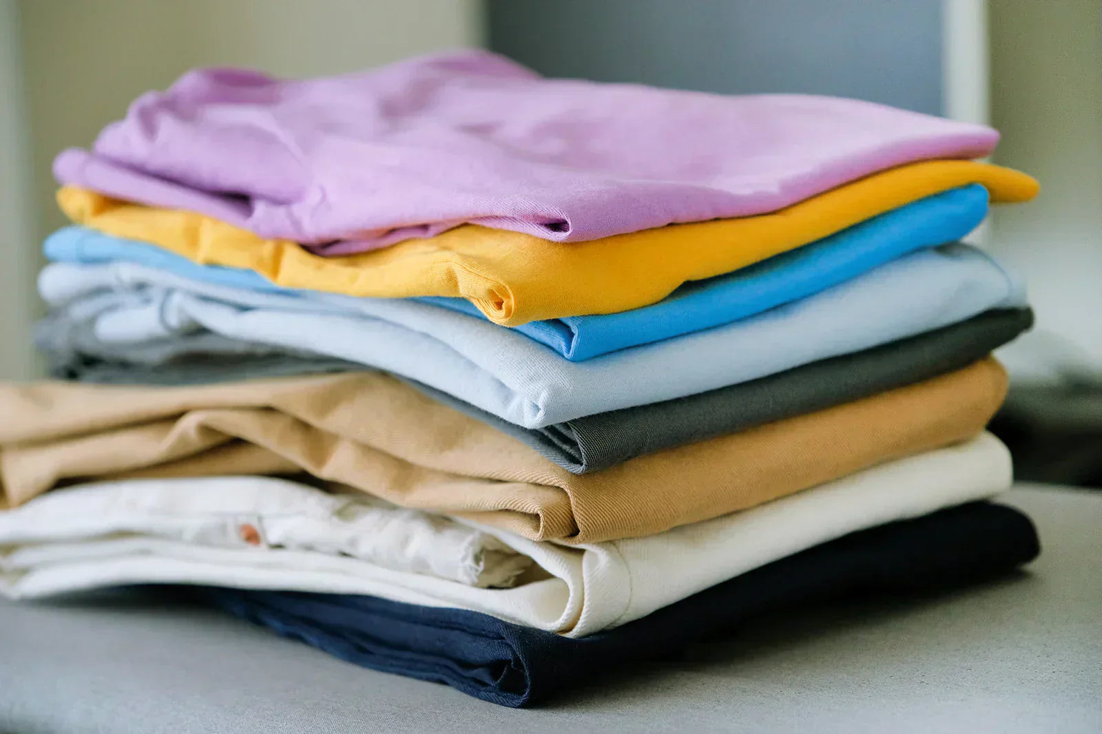 A colorful stack of folded camisoles