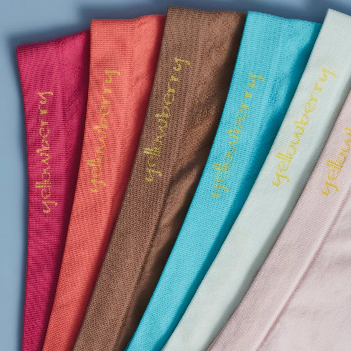 Several pair of Yellowberry Seamless Udnerwear aranged in order of color of the rainbow