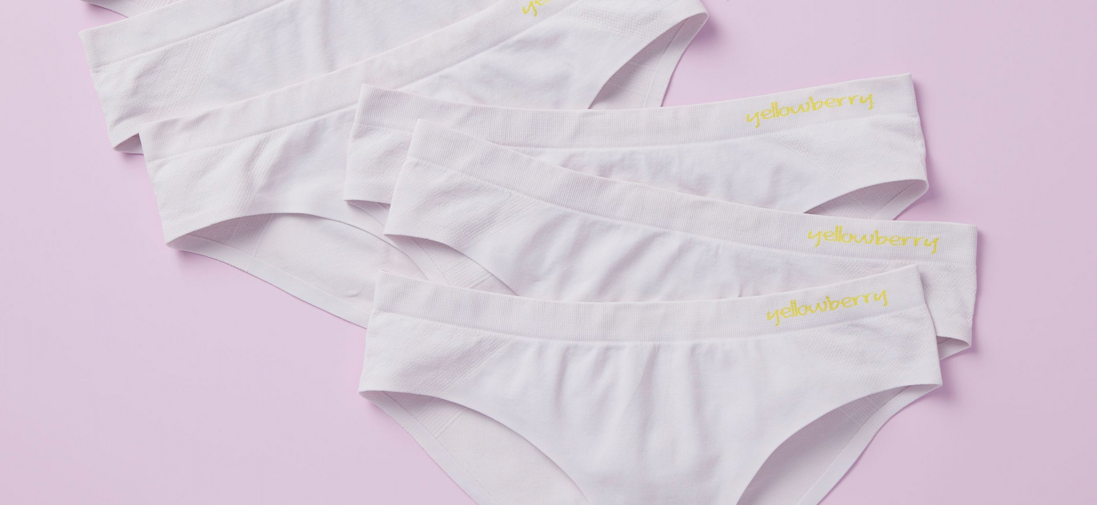 Size pair of light purple twistr seamless underwear by Yellowberry styled on a lovely, slightly darker purple background