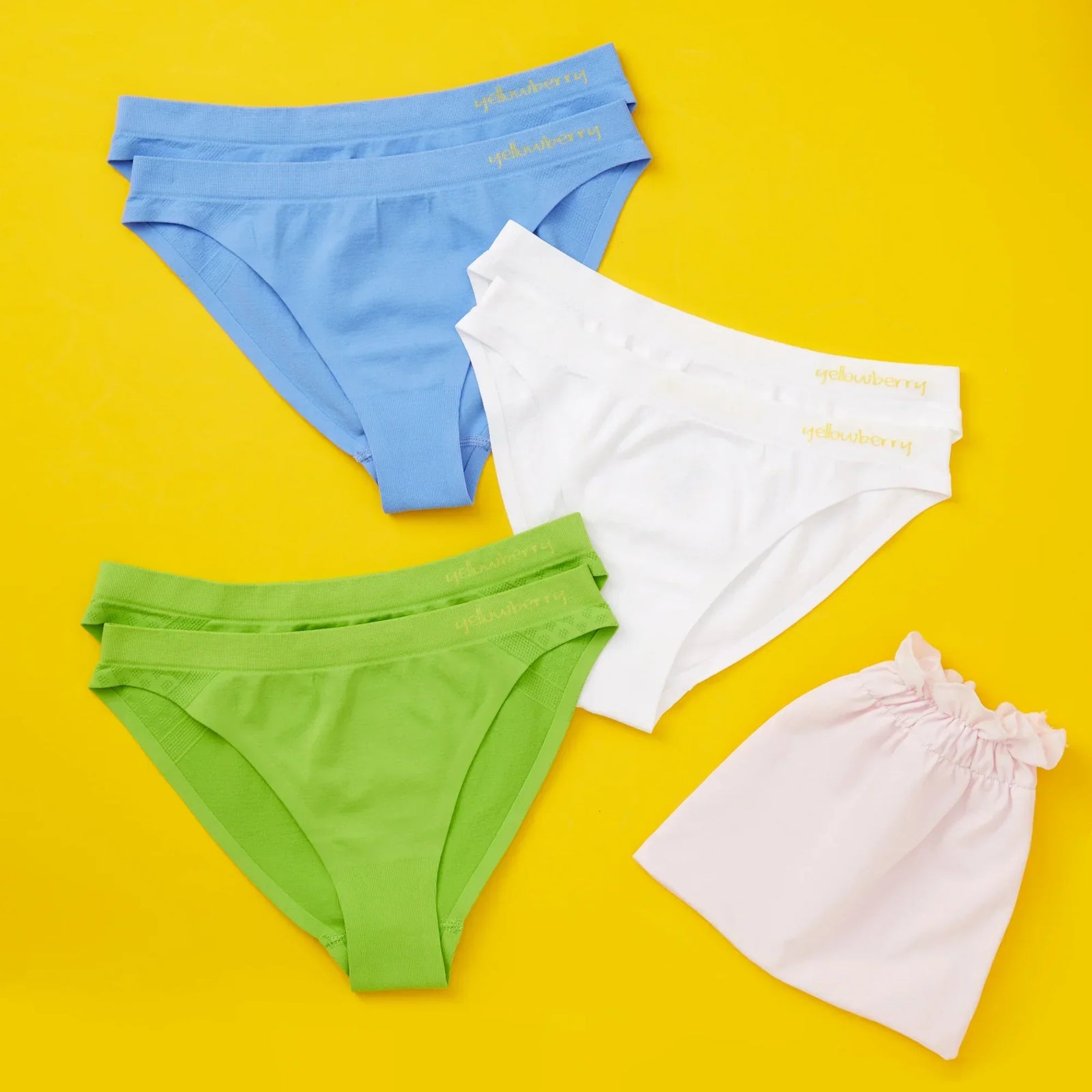 Yellowberry Scout Seamless Underwear Undle in Limebird colorway on a yellow background.