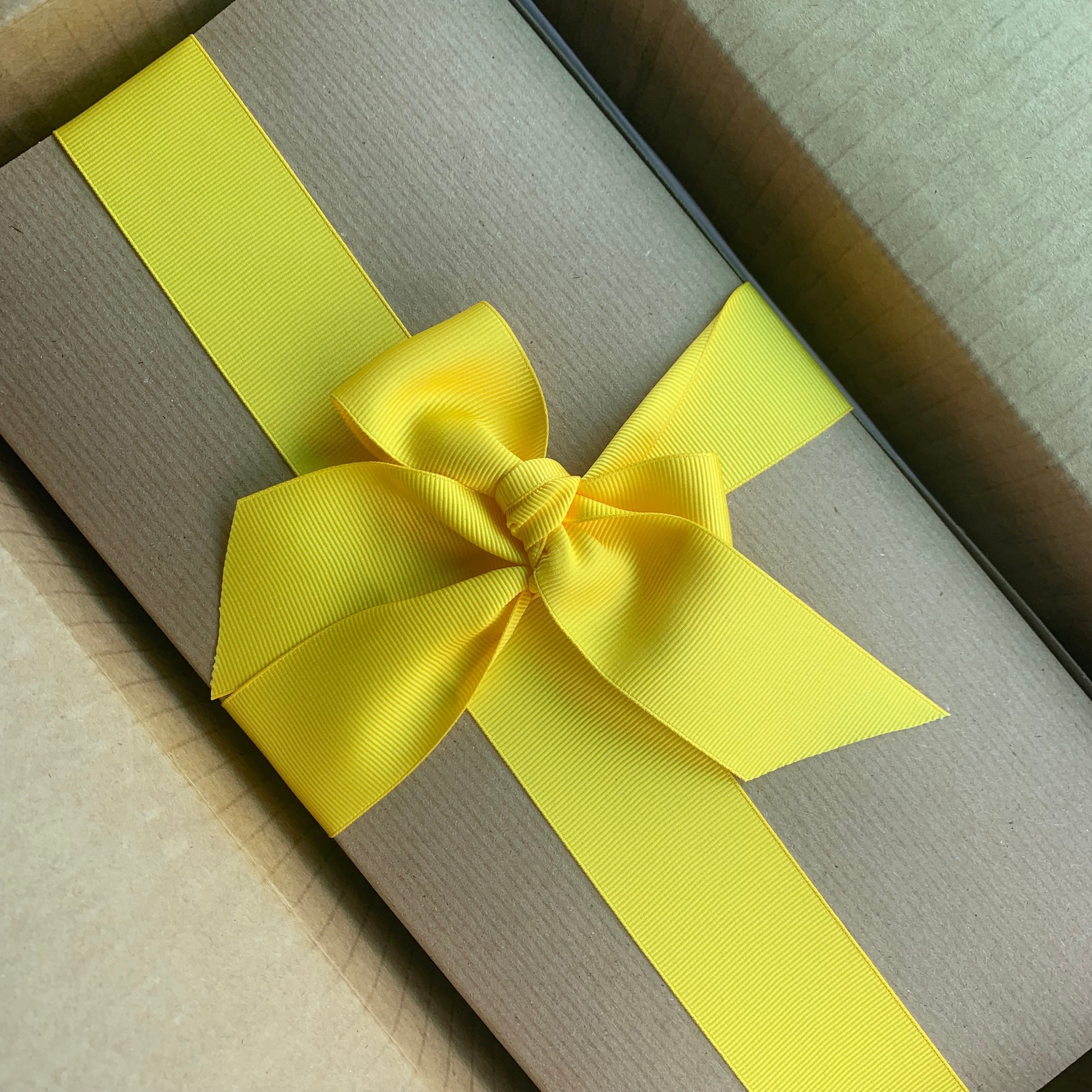 Yellowberry mailed package with a yellow ribbon tied around it