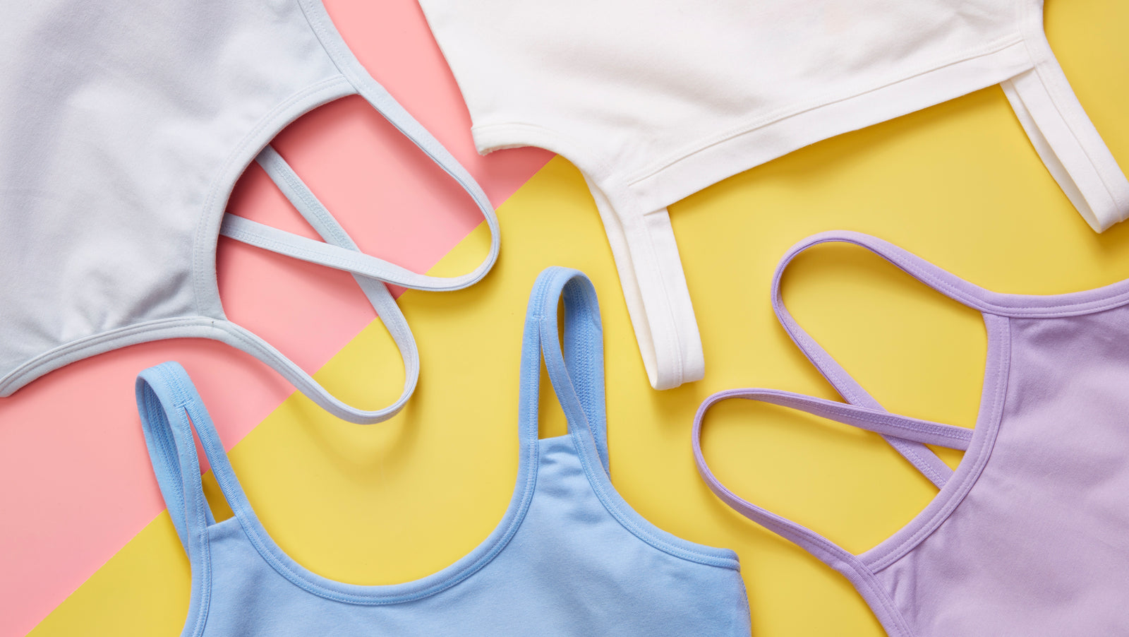Image of different style and colored camisoles on a pink and yellow background