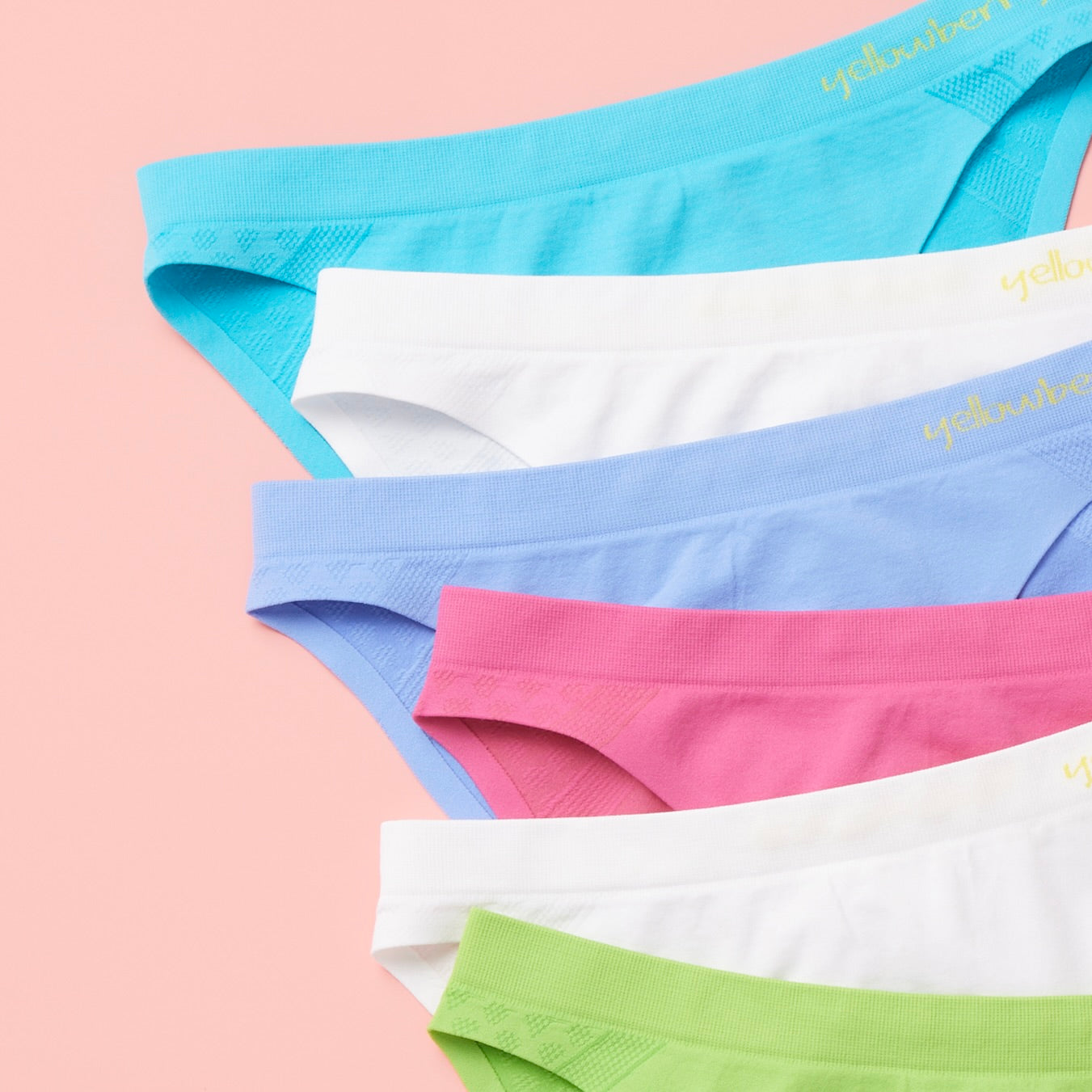 The Yellowberry commitment to excellence doesn't end with the product itself. As a female-founded brand, we're passionate about empowering girls and reducing our environmental footprint. That's why we've implemented sustainable practices throughout our supply chain, utilizing leftover fabric to create reusable fabric bags for packaging is just another way we're making a positive impact on the world. Scout Watercolor detail on peach