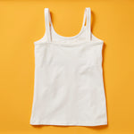 the Shell Cami, a snug, fitted tank designed with a shelf bra. The Shell makes a great option for girls who aren’t quite ready to commit to a bra but are still looking for a little bit of support. Back laydown image