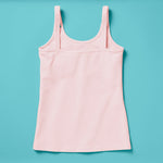 Laydown image of a light pink girls cotton tank top with a shelf bra on an aqua background, back