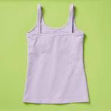 Laydown image of a light purple girls cotton tank top with a shelf bra on a soft green background, back