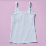 Laydown image of the back of a light blue cotton camisole with a shelf bra on a light purple background