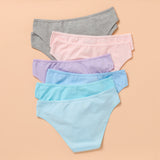 Set of eight pastel-colored underwear on a beige background