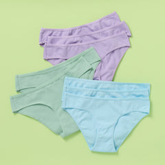 Eight pairs of women's underwear in purple, green, and blue on a light green background