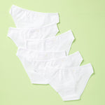 6 pair of cotton bikini underwear assembled on a light green background, back