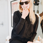 Yellowberry Downtown Hoodie in soft cotton, and effortless Style. Designed with a cross-front hood for subtle flair, it falls just below the navel, hitting the hip for a relaxed, effortless fit. Each piece in our lounge collection embodies chic, timeless style, all essentials you'll reach for all cozy season long. Made with pride in the USA, in colors thoughtfully chosen to mix and match seamlessly. We hope you enjoy them as much as we loved creating them for you. Starry Night with lip gloss