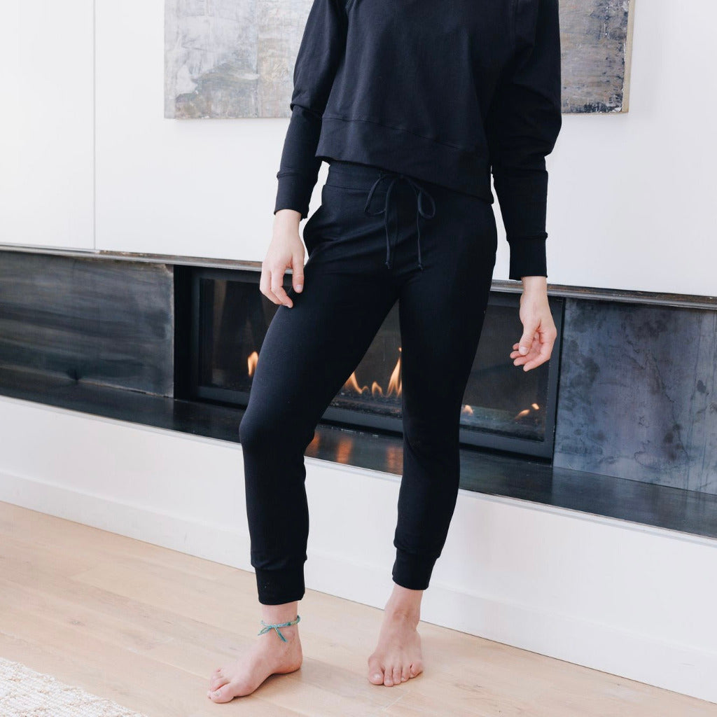 Yellowberry Downtown Hoodie in soft cotton, and effortless Style. Designed with a cross-front hood for subtle flair, it falls just below the navel, hitting the hip for a relaxed, effortless fit. Each piece in our lounge collection embodies chic, timeless style, all essentials you'll reach for all cozy season long. Made with pride in the USA, in colors thoughtfully chosen to mix and match seamlessly. We hope you enjoy them as much as we loved creating them for you. Starry Night with Uptown Jogger