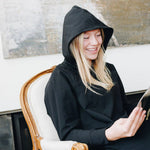 Yellowberry Downtown Hoodie in soft cotton, and effortless Style. Designed with a cross-front hood for subtle flair, it falls just below the navel, hitting the hip for a relaxed, effortless fit. Each piece in our lounge collection embodies chic, timeless style, all essentials you'll reach for all cozy season long. Made with pride in the USA, in colors thoughtfully chosen to mix and match seamlessly. We hope you enjoy them as much as we loved creating them for you. Starry Night with hood up