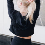 Yellowberry Downtown Hoodie in soft cotton, and effortless Style. Designed with a cross-front hood for subtle flair, it falls just below the navel, hitting the hip for a relaxed, effortless fit. Each piece in our lounge collection embodies chic, timeless style, all essentials you'll reach for all cozy season long. Made with pride in the USA, in colors thoughtfully chosen to mix and match seamlessly. We hope you enjoy them as much as we loved creating them for you. Starry Night hands over head