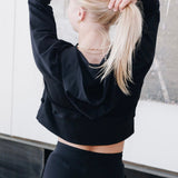 Yellowberry Downtown Hoodie in soft cotton, and effortless Style. Designed with a cross-front hood for subtle flair, it falls just below the navel, hitting the hip for a relaxed, effortless fit. Each piece in our lounge collection embodies chic, timeless style, all essentials you'll reach for all cozy season long. Made with pride in the USA, in colors thoughtfully chosen to mix and match seamlessly. We hope you enjoy them as much as we loved creating them for you. Starry Night hands over head