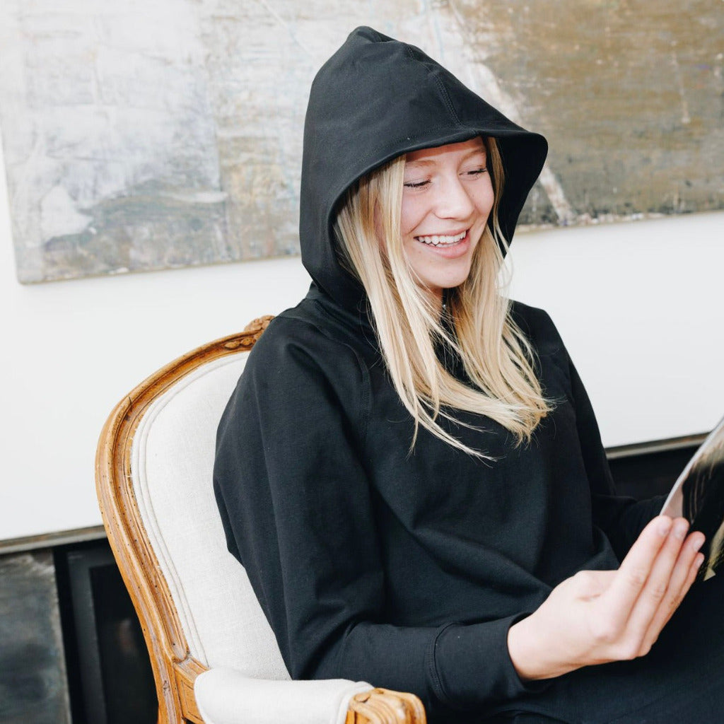 Yellowberry Downtown Hoodie in soft cotton, and effortless Style. Designed with a cross-front hood for subtle flair, it falls just below the navel, hitting the hip for a relaxed, effortless fit. Each piece in our lounge collection embodies chic, timeless style, all essentials you'll reach for all cozy season long. Made with pride in the USA, in colors thoughtfully chosen to mix and match seamlessly. We hope you enjoy them as much as we loved creating them for you. Black Starry Night Reading 