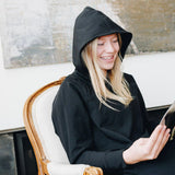 Yellowberry Downtown Hoodie in soft cotton, and effortless Style. Designed with a cross-front hood for subtle flair, it falls just below the navel, hitting the hip for a relaxed, effortless fit. Each piece in our lounge collection embodies chic, timeless style, all essentials you'll reach for all cozy season long. Made with pride in the USA, in colors thoughtfully chosen to mix and match seamlessly. We hope you enjoy them as much as we loved creating them for you. Black Starry Night Reading 