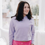 Yellowberry Downtown Hoodie in soft cotton, and effortless Style. Designed with a cross-front hood for subtle flair, it falls just below the navel, hitting the hip for a relaxed, effortless fit. Each piece in our lounge collection embodies chic, timeless style, all essentials you'll reach for all cozy season long. Made with pride in the USA, in colors thoughtfully chosen to mix and match seamlessly. We hope you enjoy them as much as we loved creating them for you. Huckleberry front on model in window