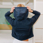 Yellowberry Downtown Hoodie in soft cotton, and effortless Style. Designed with a cross-front hood for subtle flair, it falls just below the navel, hitting the hip for a relaxed, effortless fit. Each piece in our lounge collection embodies chic, timeless style, all essentials you'll reach for all cozy season long. Made with pride in the USA, in colors thoughtfully chosen to mix and match seamlessly. We hope you enjoy them as much as we loved creating them for you. Moonbeam Navy front raising hood