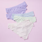 Best-Selling Twistr Girls Seamless Bikini cut underwear by Yellowberry. Back image of multi bundle on lilac background. 