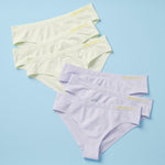 Best-Selling Twistr Girls Seamless Bikini cut underwear by Yellowberry. Front image of Cloud Power (light green and light lilac) bundle on blue background. 