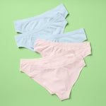 Best-Selling Twistr Girls Seamless Bikini cut underwear by Yellowberry. Back image of Tulle (light pink and light blue colors) bundle on green background. 