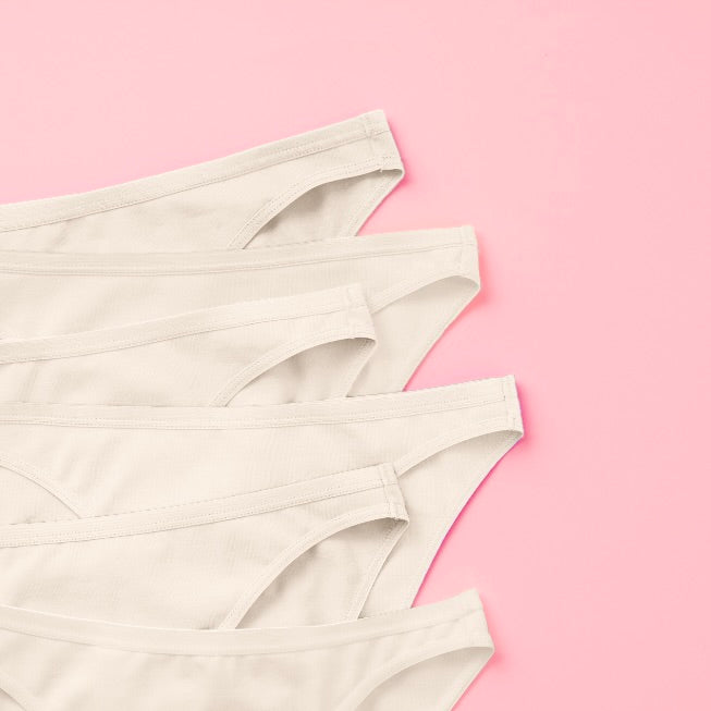 Yellowberry Petal Pima Cotton Bikini Underwear Bundle has a fuller coverage bottom. Made from luxurious Pima Cotton infused with a hint of Spandex, these undies provide the perfect amount of stretch for ultimate comfort and flexibility. The elastic waistband ensures a snug yet gentle fit, while the easy care instructions make laundry day a breeze. Snowflake White 6PK on pink detail