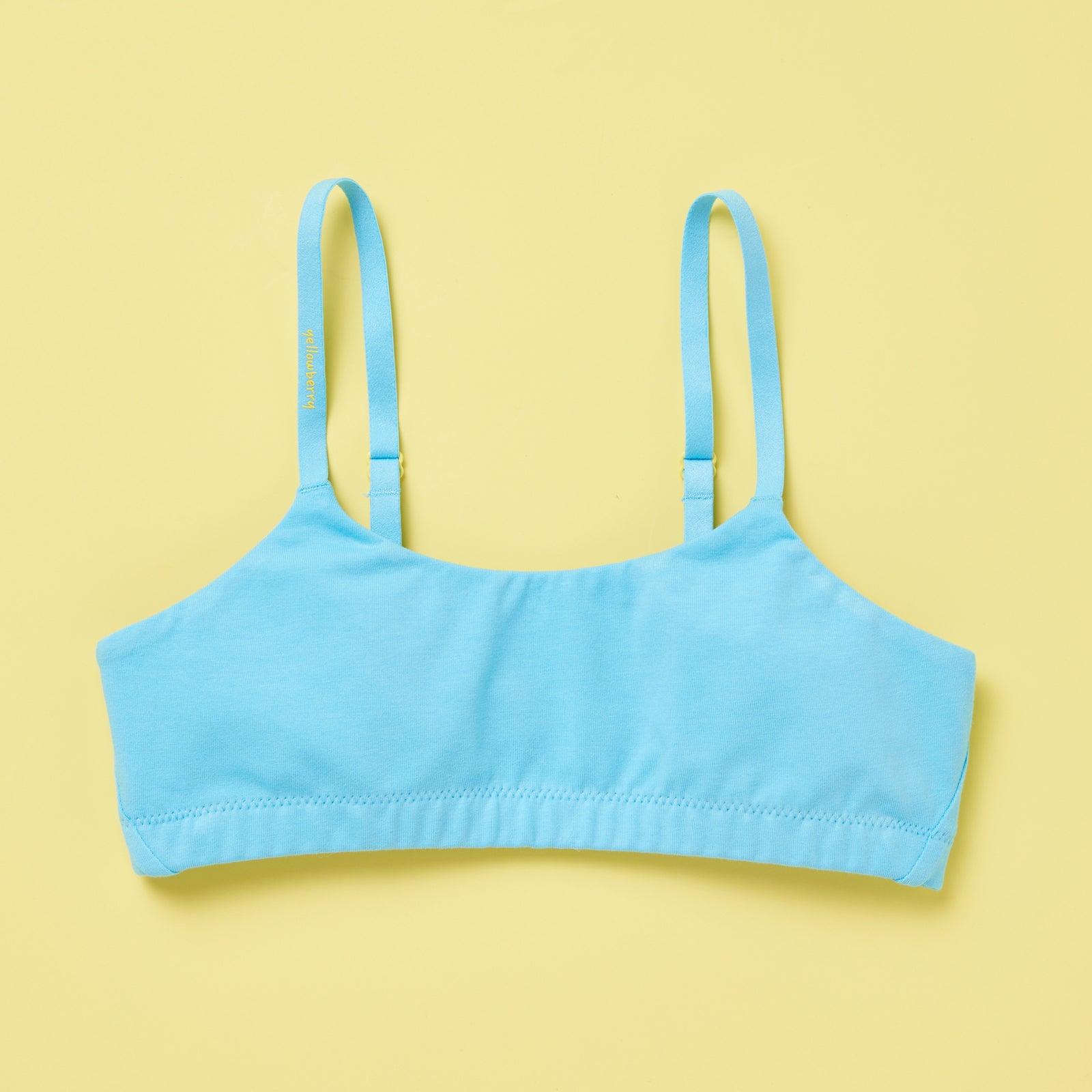 Yellowberry Pipit Training Bra for girls in Wave (aqua blue) on a light yellow background, front