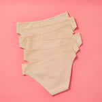 Yellowberry Simple Underwear In Doe Beige Back image on coral background bundle 6PK of Pima Cotton Underwear, designed with the utmost care and critique from moms and daughters far and wide. With a full coverage bottom and soft cotton construction, this underwear is high quality and great all day comfort.