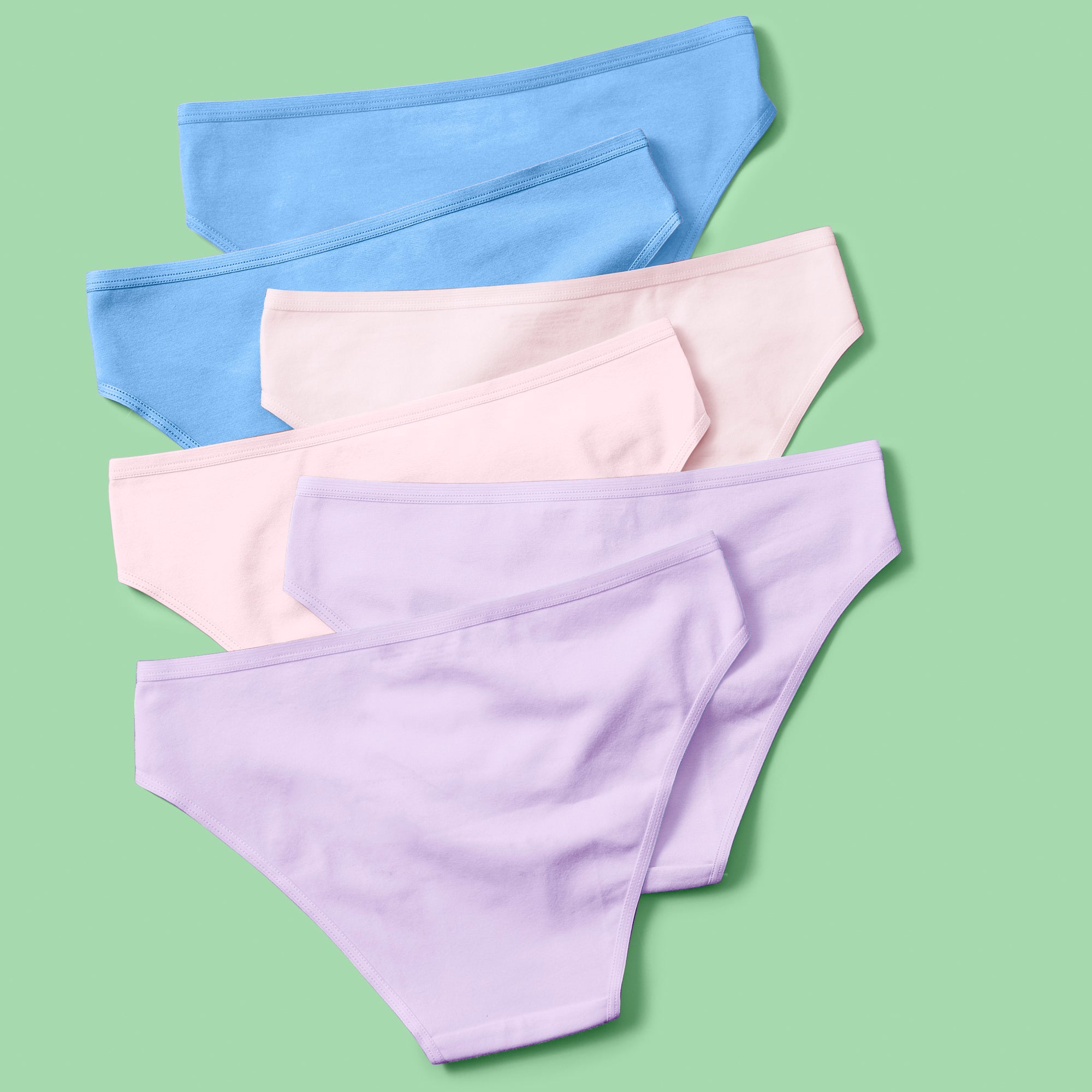 Yellowberry Simple Underwear In Multi Back image on green background bundle 6PK of Pima Cotton Underwear, designed with the utmost care and critique from moms and daughters far and wide. With a full coverage bottom and soft cotton construction, this underwear is high quality and great all day comfort.