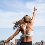 Yellowberry Classic Tink Sports Bra in our newest color, Storm. Beautiful as a new neutral with a hint of a city pale grey. Beautiful on all skin tones and a great top drawer addition. Girl on rooftop in NYC