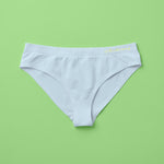 Yellowberry Twistr Seamless Underwear in Raindrop (light blue color) on a green background. These underwear are true seamless, high quality girls underwear and made with super soft fabrics. Girl and mom approved!