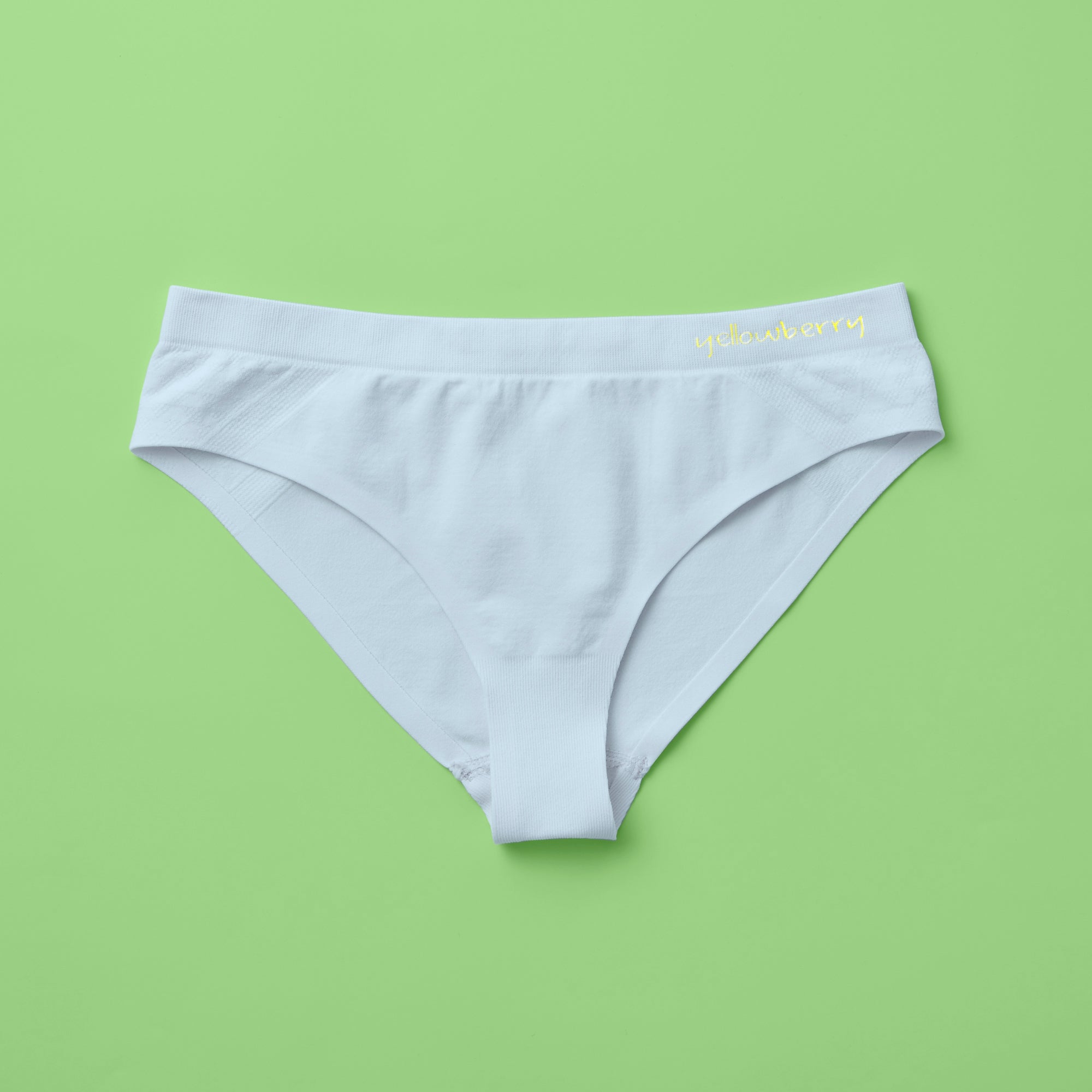 Yellowberry Twistr Seamless Underwear in Raindrop (light blue color) on a green background. These underwear are true seamless, high quality girls underwear and made with super soft fabrics. Girl and mom approved!