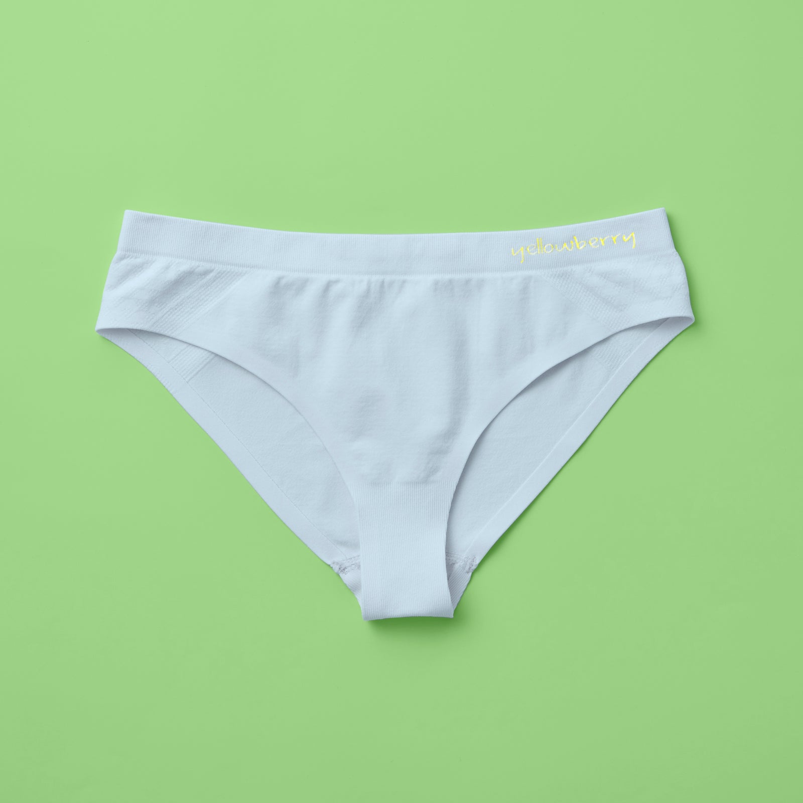 Yellowberry Twistr Seamless Underwear in Raindrop (light blue color) on a green background. These underwear are true seamless, high quality girls underwear and made with super soft fabrics. Girl and mom approved!