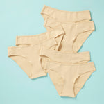 6 pair of girls cotton bikini cut underwear on an aqua background, front