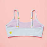 Light blue and purple bra with yellow accents on a pink background