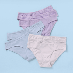Eight pairs of women's high-waisted briefs in pastel shades of lavender, light blue, and pale pink, arranged in a stacked fan layout on a solid light blue background.