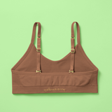 Brown bra with straps on a green background, featuring the brand 'yellowberry'.