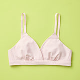 Yellowberry Butter Bra in bubblegum (light pink), front laydown detail image. The BEST Bra We Make for More Developed Girls. Fabric is smooth to the touch and made with a matte brushed finish for extra softness. Made with synthetic fabric blend and hook and eye clasp closure. Great for developing girls. Wear and wash is over and over again, it will still look brand new. It will grow with your daughter as she continues to grow, great option for any occasion.