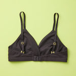 Yellowberry Butter Bra in starry night (black), back laydown detail image. The BEST Bra We Make for More Developed Girls. Fabric is smooth to the touch and made with a matte brushed finish for extra softness. Made with synthetic fabric blend and hook and eye clasp closure. Great for developing girls. Wear and wash is over and over again, it will still look brand new. It will grow with your daughter as she continues to grow, great option for any occasion.