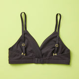 Yellowberry Butter Bra in starry night (black), back laydown detail image. The BEST Bra We Make for More Developed Girls. Fabric is smooth to the touch and made with a matte brushed finish for extra softness. Made with synthetic fabric blend and hook and eye clasp closure. Great for developing girls. Wear and wash is over and over again, it will still look brand new. It will grow with your daughter as she continues to grow, great option for any occasion.