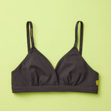 Yellowberry Butter Bra in starry night (black), front laydown detail image. The BEST Bra We Make for More Developed Girls. Fabric is smooth to the touch and made with a matte brushed finish for extra softness. Made with synthetic fabric blend and hook and eye clasp closure. Great for developing girls. Wear and wash is over and over again, it will still look brand new. It will grow with your daughter as she continues to grow, great option for any occasion.