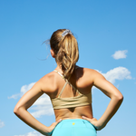 Girl wearing Yellowberry Ladybug Bra in caramel nude color. Softest first bra ever made. Best possible first bra for girls. Full coverage, convertible straps. All natural fabrics and fibers. Perfect fit, highest quality construction, design, and care. Great for sensitive skin.