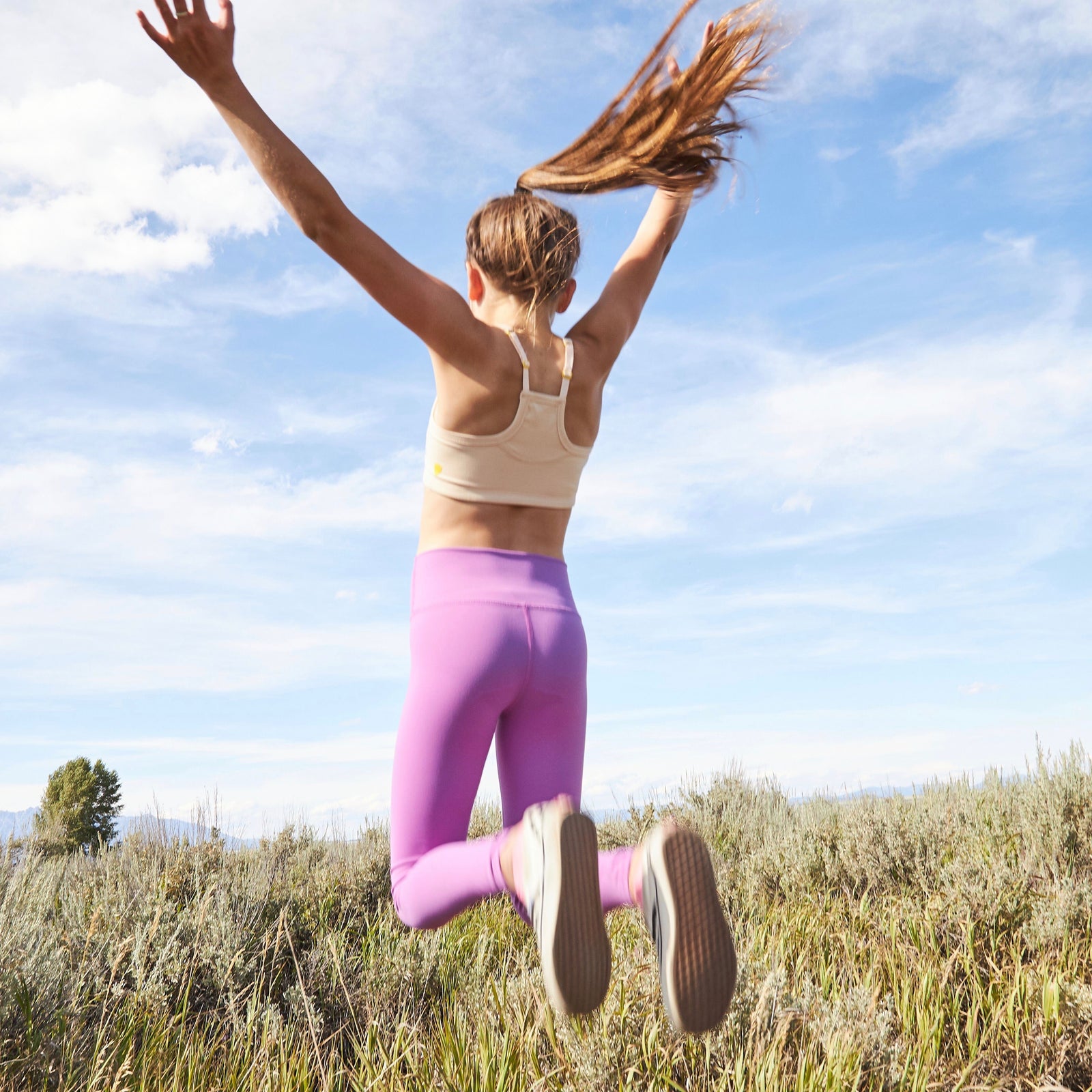 Featuring a classic racerback shape, the Firefly is made to give girls at any stage of development the exceptional support without sacrificing comfort. Made with active girls in mind, the Firefly is terrific for sports as well as an all day, every day super comfortable, super soft first training bra. Jumping Model Mormon Row against blue sky