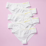 Best-Selling Twistr Girls Seamless Bikini cut underwear by Yellowberry. Front image of Snowflake (white) bundle on pink background. 