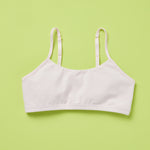 Front laydown detail image of best-selling Yellowberry Ladybug Bra in the color Bubblegum pink. The Absolute Best First Bra Ever Made. The Ladybug is our #1 best-selling bra for a reason. Built with a thicker, double layered cotton fabric, it ensures full coverage and support. All natural fabrics, incredibly soft. Anti microbial. Everyday bra for girls, tweens, and teens. Cotton fabric. Great for sensitive skin.