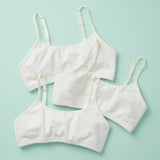 3PK of the original Yellowberry Training Bra for girls. Front Laydown image of three white bras on mint ground. The first bra that changed the industry of bras and underwear.