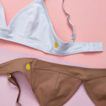 A beautiful Yellowberry soft Lily bra detail image in Raindrop and Mocha on a Yellowberry salmon background.